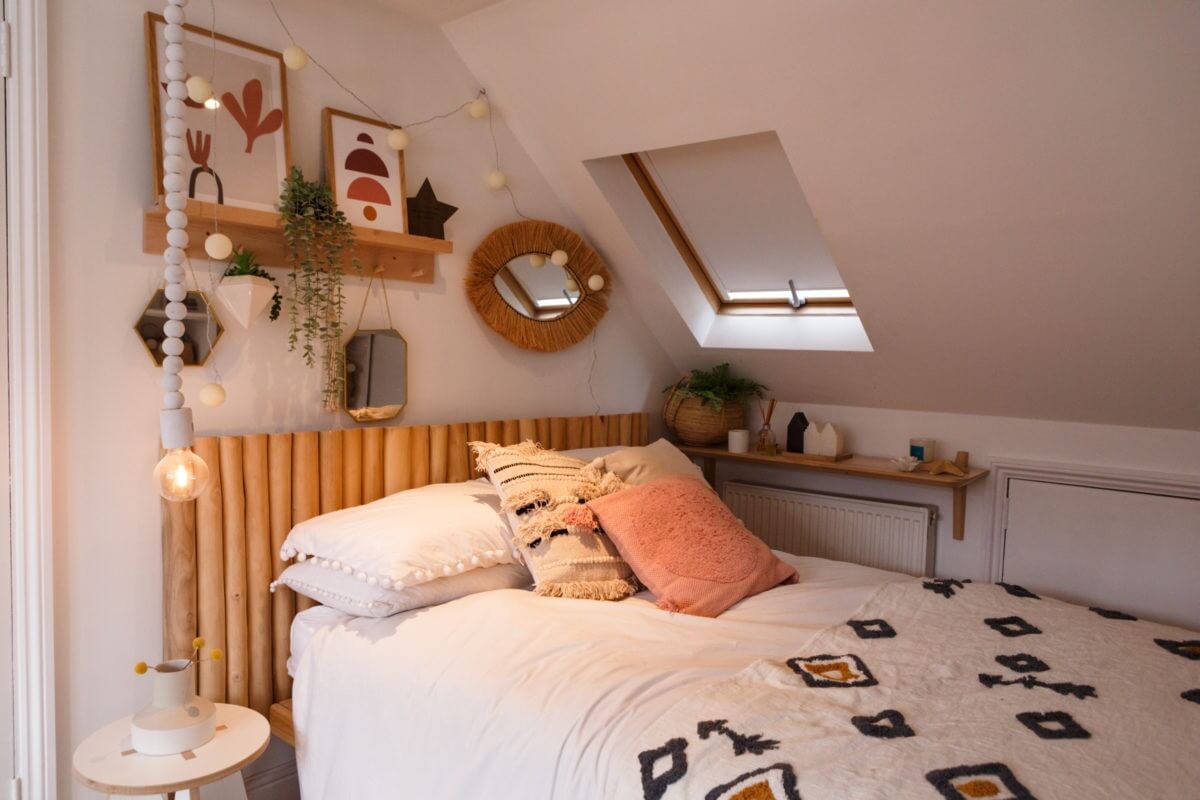 A Colorful Maximalist Home in London 42 attic-bedroom-shelves-wooden-headboard-slanted-ceiling-nordroom