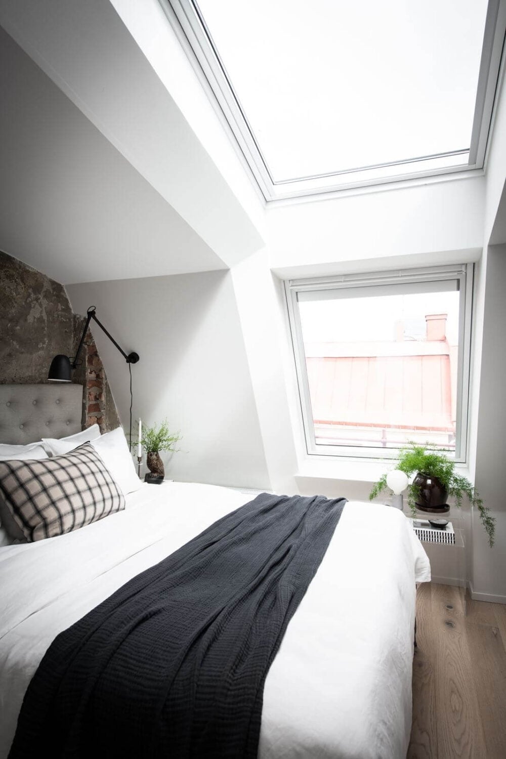 Best of 2022: Loft Apartments 8 attic-bedroom-skylight-raw-wall-nordic-design-nordroom