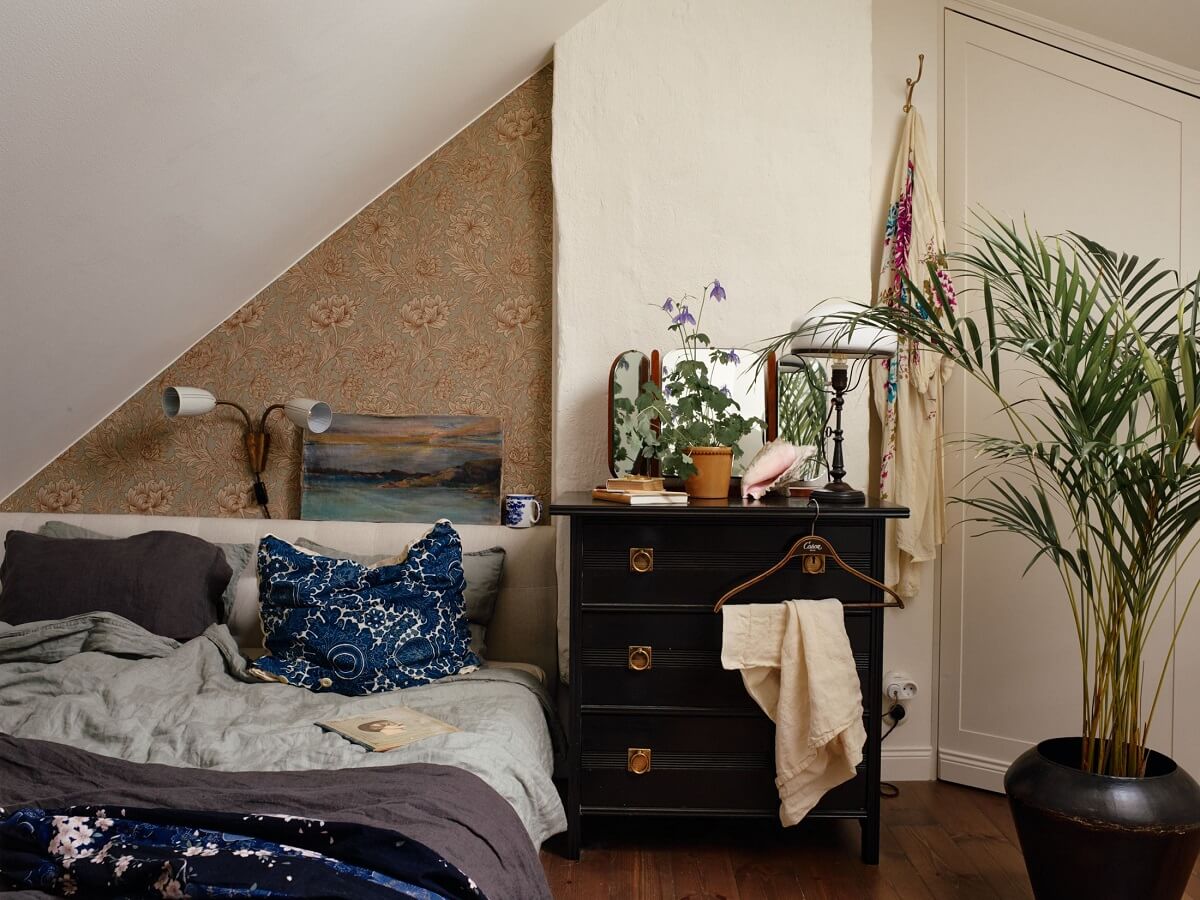 A Cozy Vintage Bohemian Maisonette in Sweden 21 attic-bedroom-vintage-drawers-nordroom