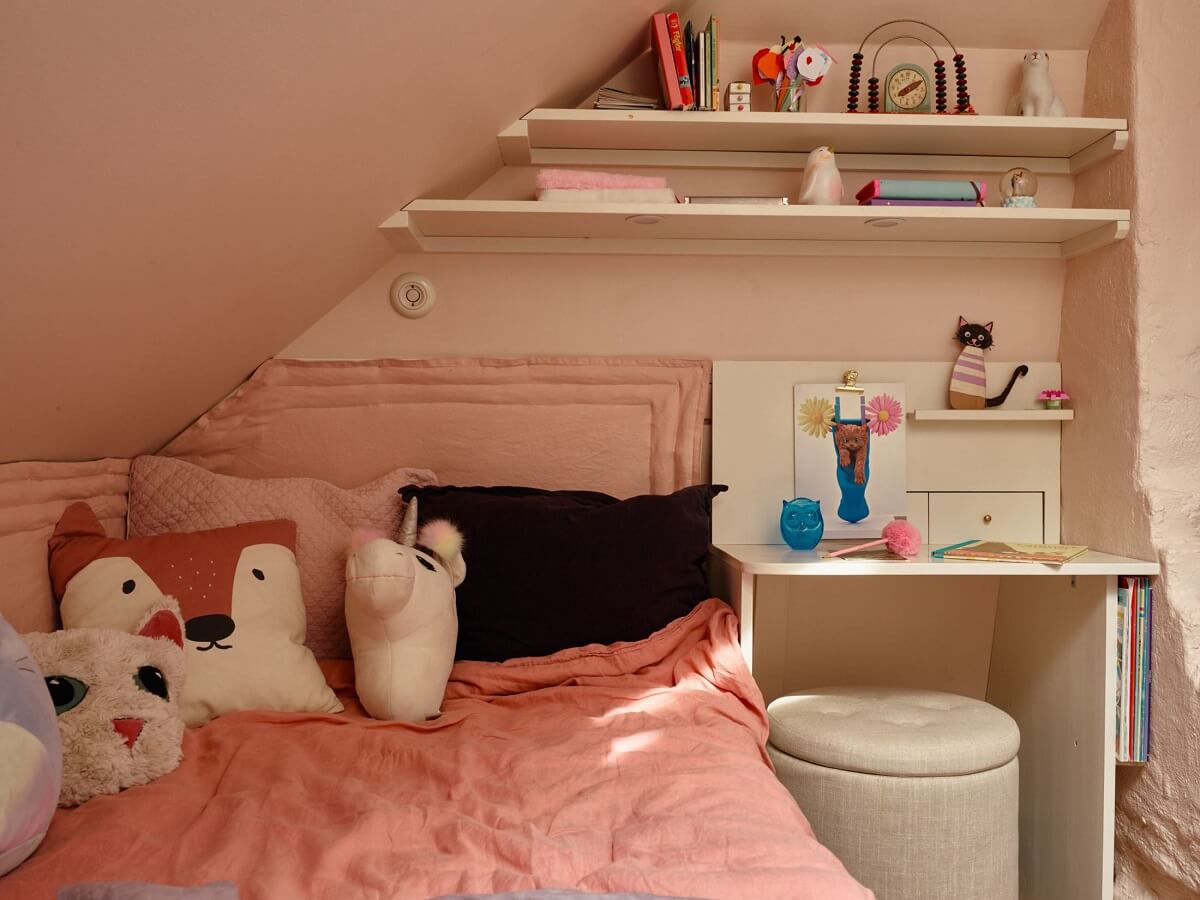A Cozy Vintage Bohemian Maisonette in Sweden 27 attic-kids-bedroom-slanted-ceiling-desk-shelves-nordroom