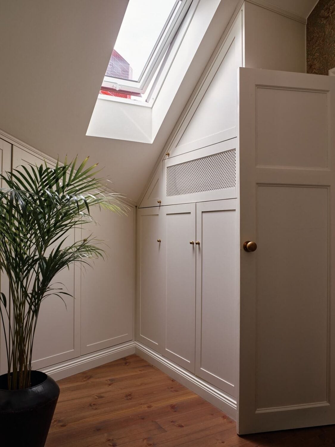 A Cozy Vintage Bohemian Maisonette in Sweden 23 attic-room-closet-under-slanted-ceiling-nordroom