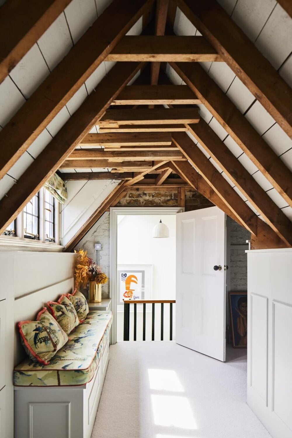 An Arts and Crafts House with Colorful Rooms 30 attic-room-exposed-wooden-beams-bench-nordroom