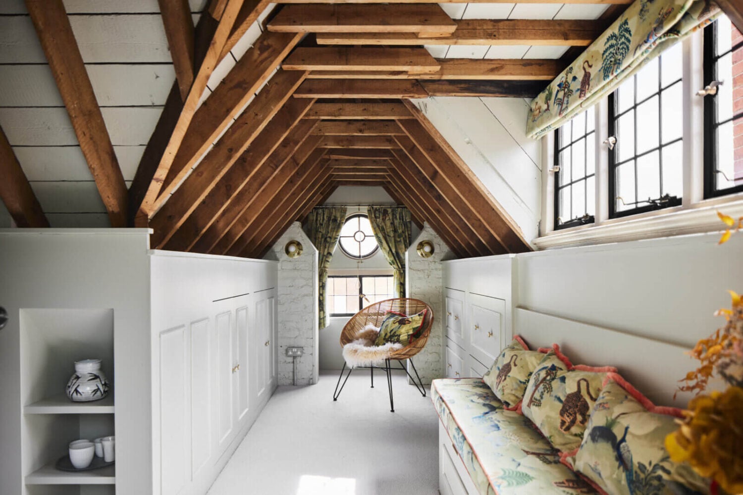 An Arts and Crafts House with Colorful Rooms 28 attic-room-exposed-wooden-beams-nordroom