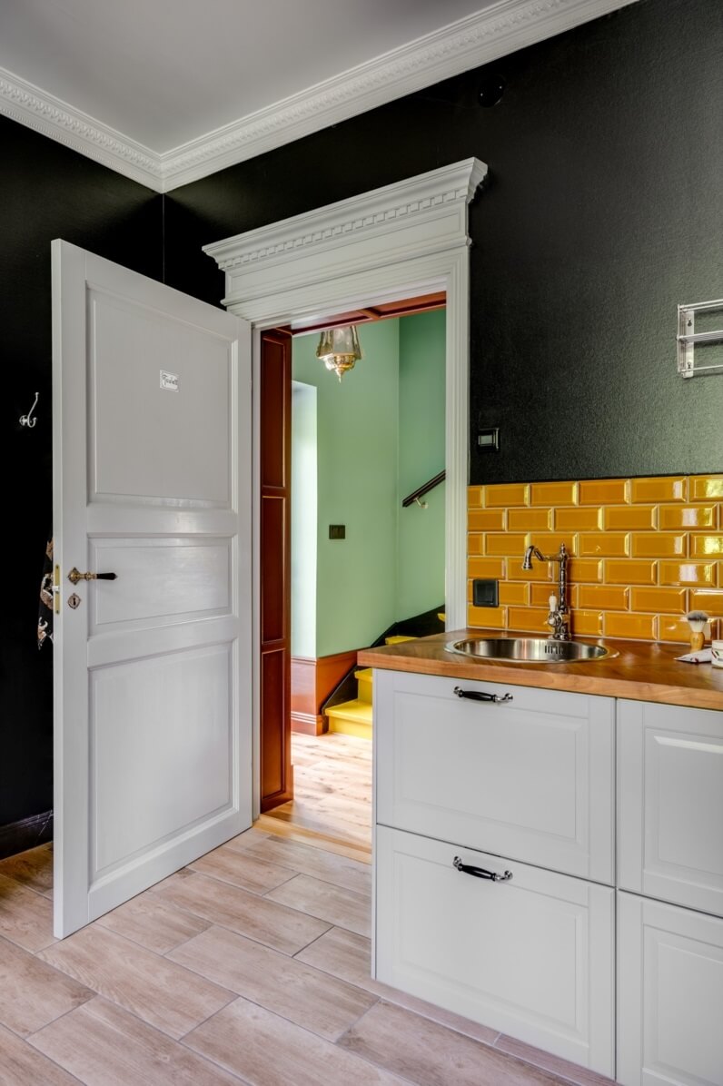 A Colorful Family Home in a Former School Building 24 bathroom-black-walls-orange-tiles-nordroom