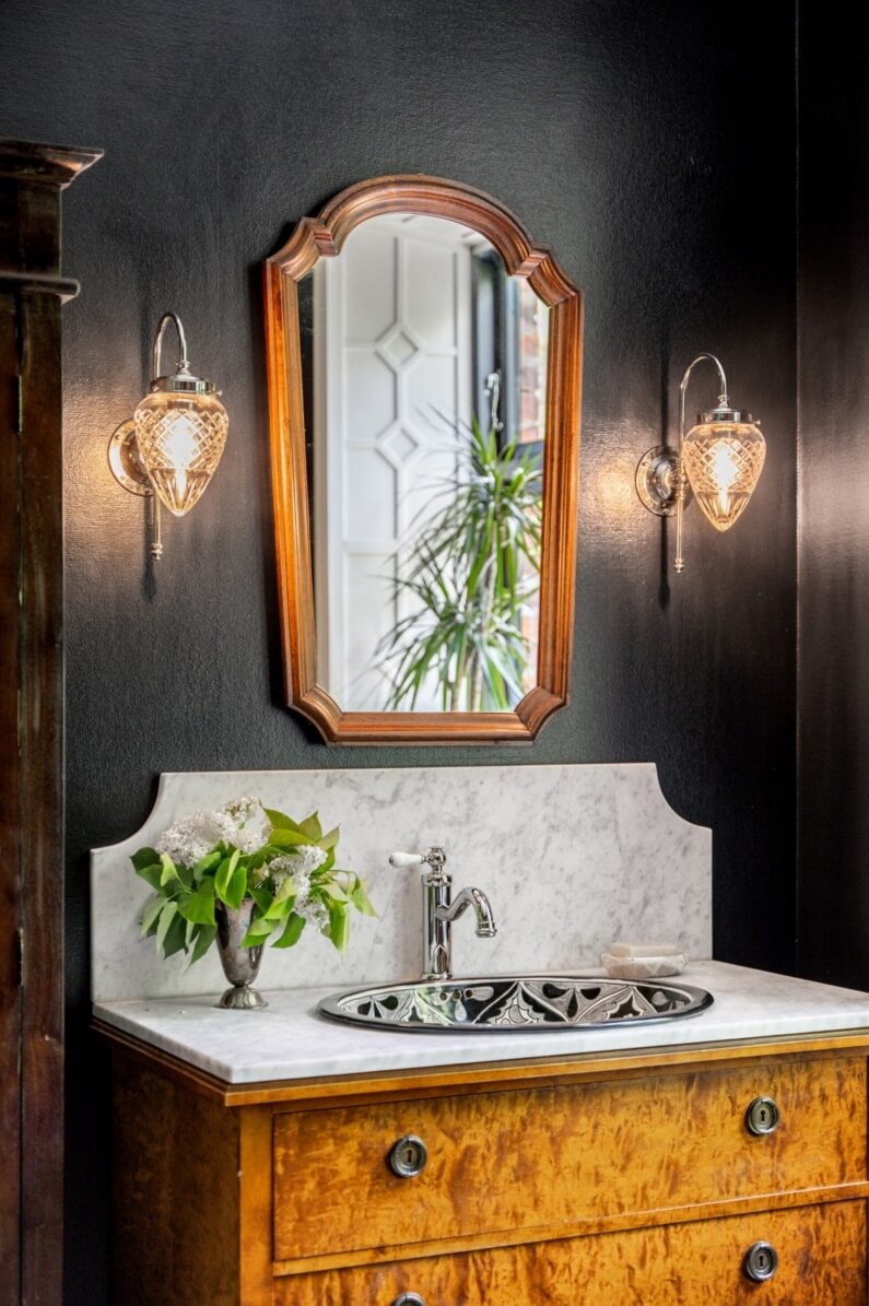 A Colorful Family Home in a Former School Building 22 bathroom-black-walls-vintage-vanity-nordroom