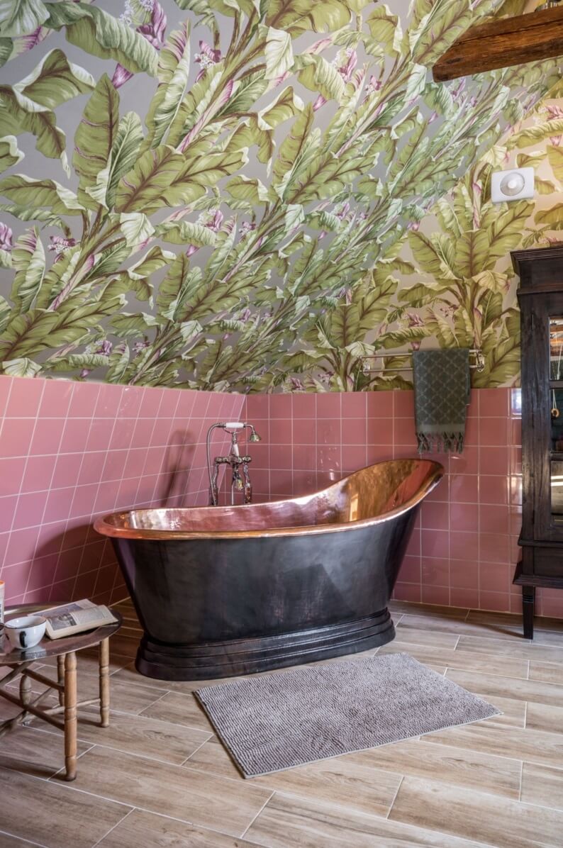 A Colorful Family Home in a Former School Building 32 bathroom-copper-bath-pink-tiles-palm-wallpaper-nordroom