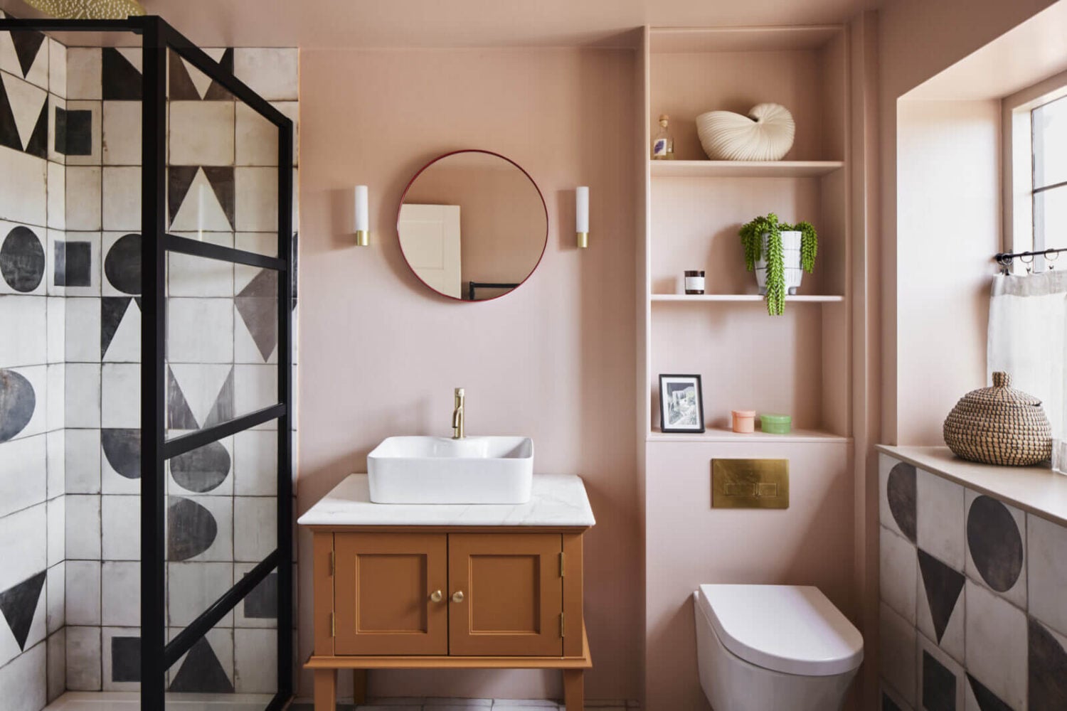 An Arts and Crafts House with Colorful Rooms 24 bathroom-pink-walls-black-white-tiles-shelves-above-toilet-nordroom