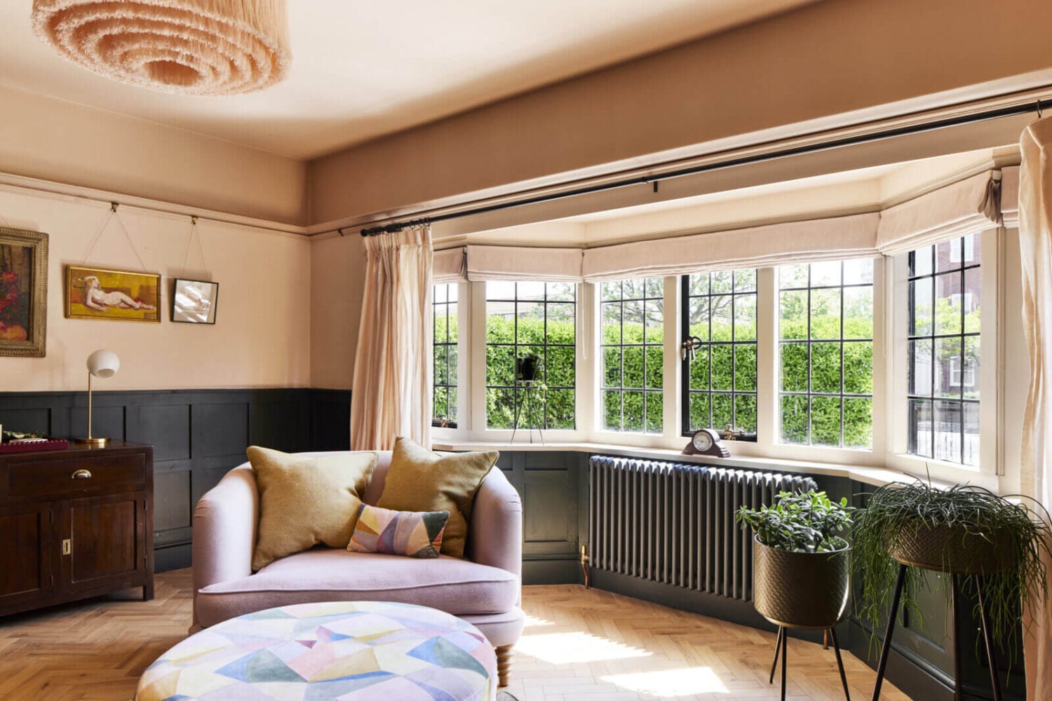 An Arts and Crafts House with Colorful Rooms 3 bay-window-wood-panels-sitting-room-nordroom