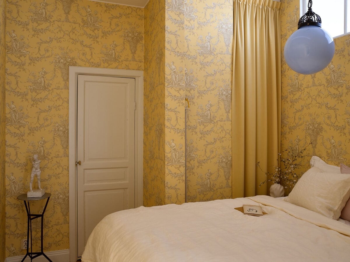 A Bedroom with Yellow French Wallpaper in a Small Scandi Home 11 bedroom-French-yellow-wallpaper-wardrobe-curtain-nordroom