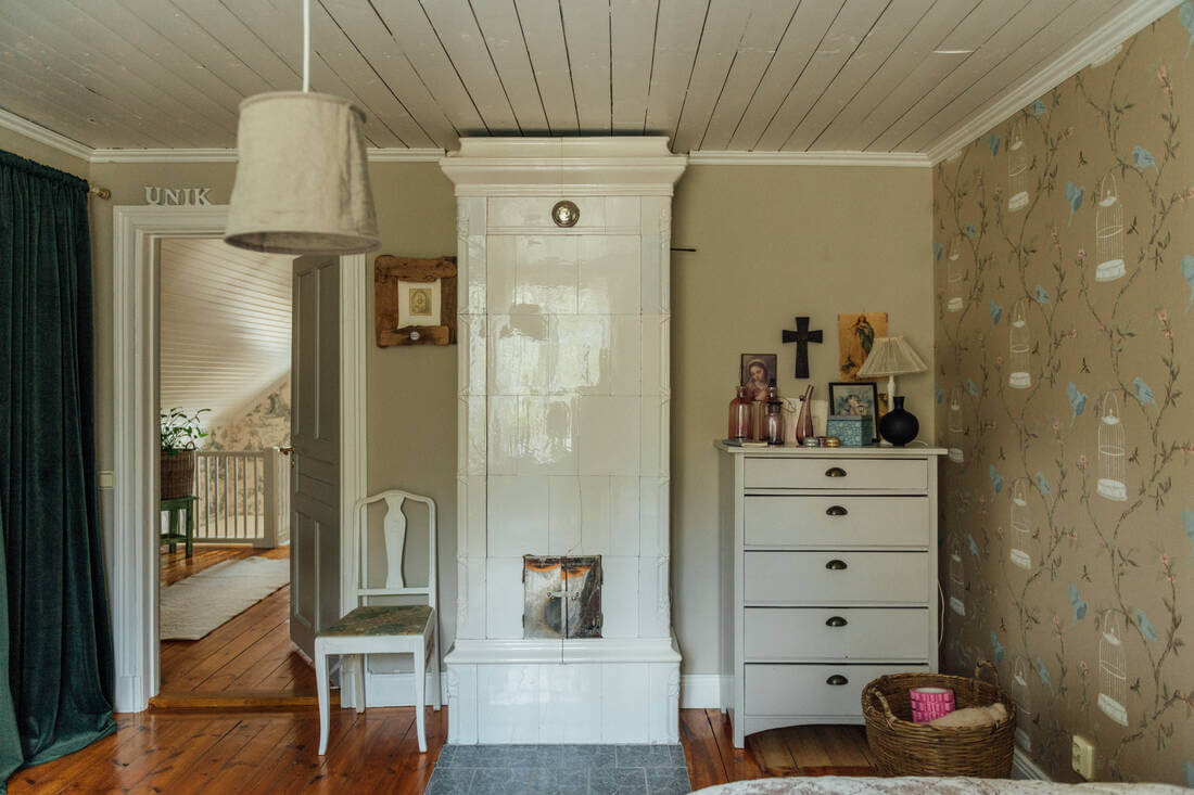 A Vintage Bohemian Country House in Sweden 12 bedroom-fireplace-wallpaper-nordroom