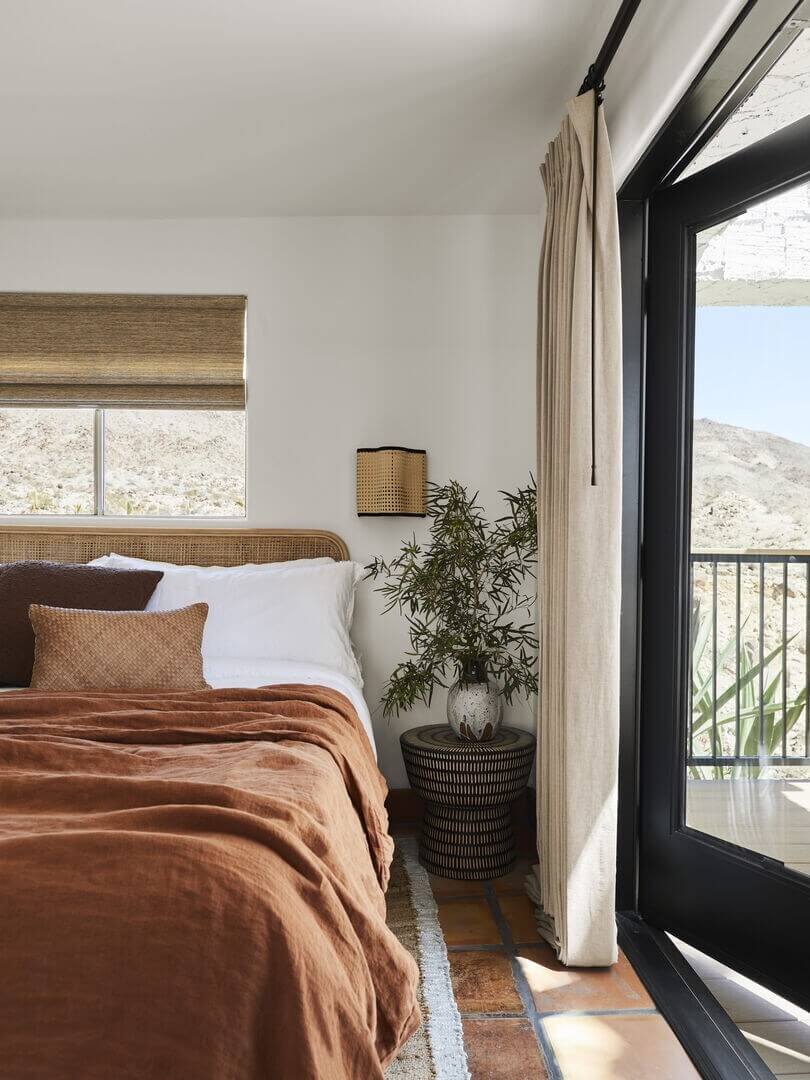 Queer Eye's Bobby Berk Designed An Airbnb Villa in California 10 bedroom-stone-floor-earthy-colored-textiles-nordroom