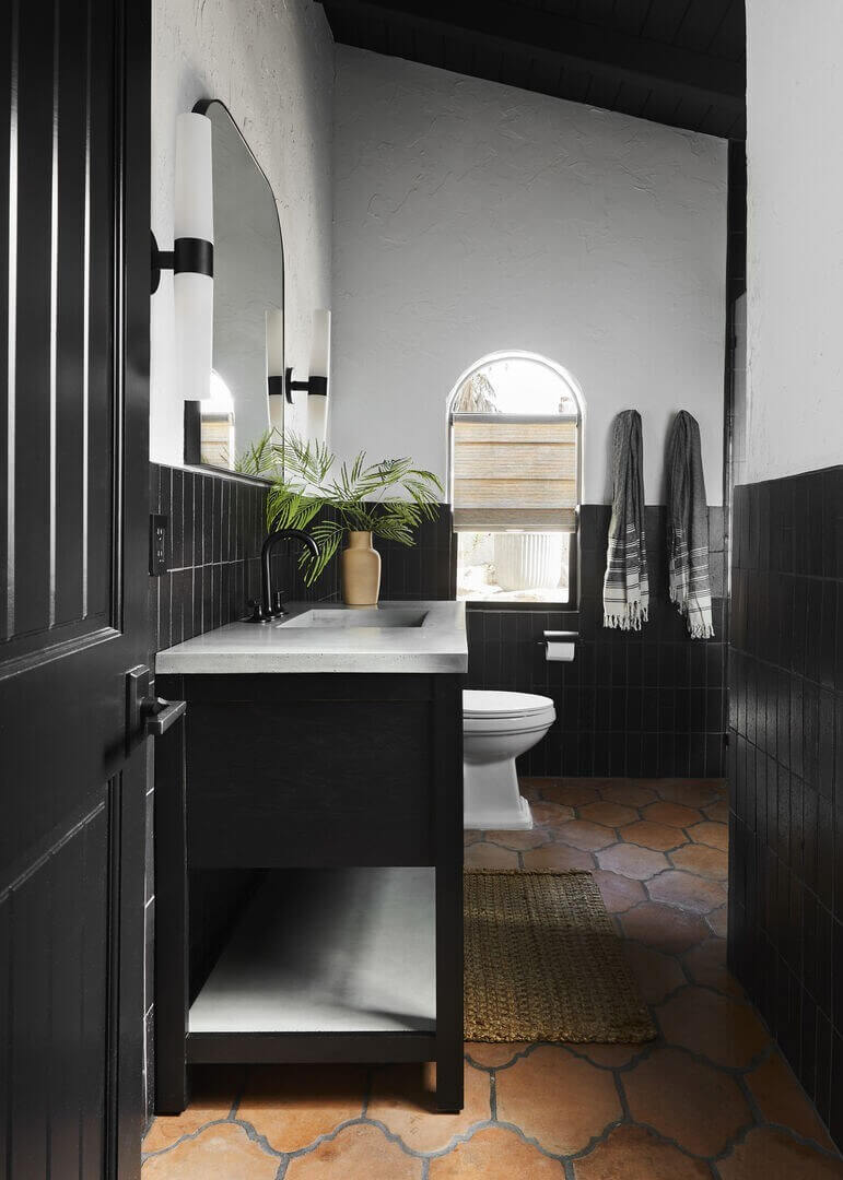 Queer Eye's Bobby Berk Designed An Airbnb Villa in California 9 black-bathroom-stone-floor-spanish-style-airbnb-home-california-nordroom