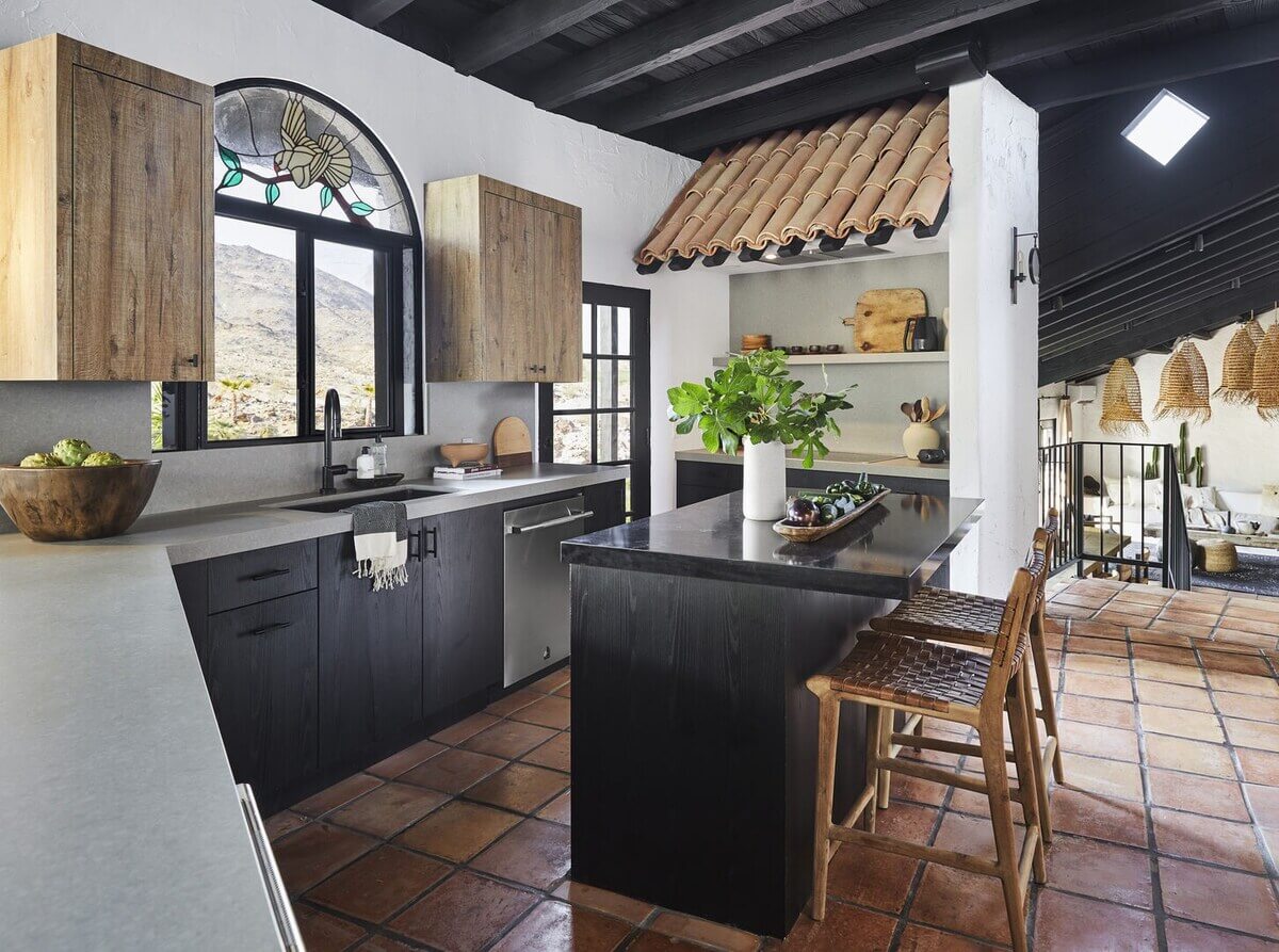 Queer Eye's Bobby Berk Designed An Airbnb Villa in California 3 black-kitchen-cabinets-stone-floor-airbnb-bobby-berk-nordroom