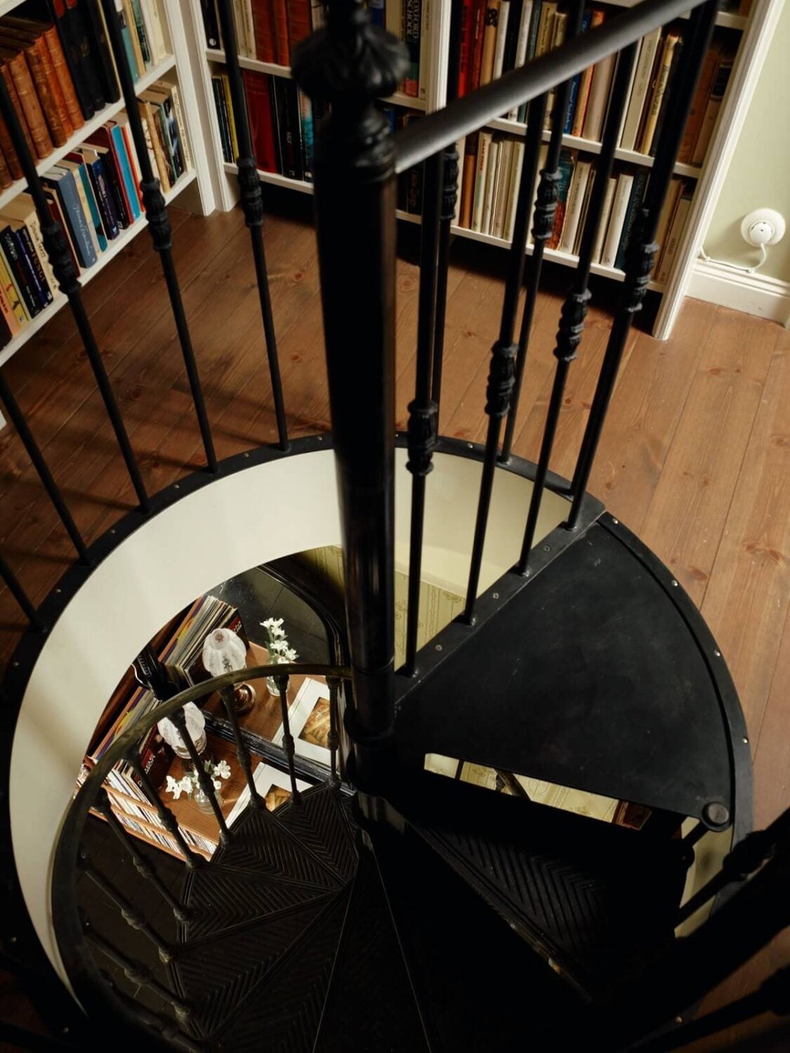 A Cozy Vintage Bohemian Maisonette in Sweden 17 black-spiral-staircase-nordroom