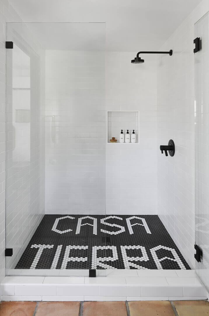 Queer Eye's Bobby Berk Designed An Airbnb Villa in California 11 black-white-walk-in-shower-nordroom