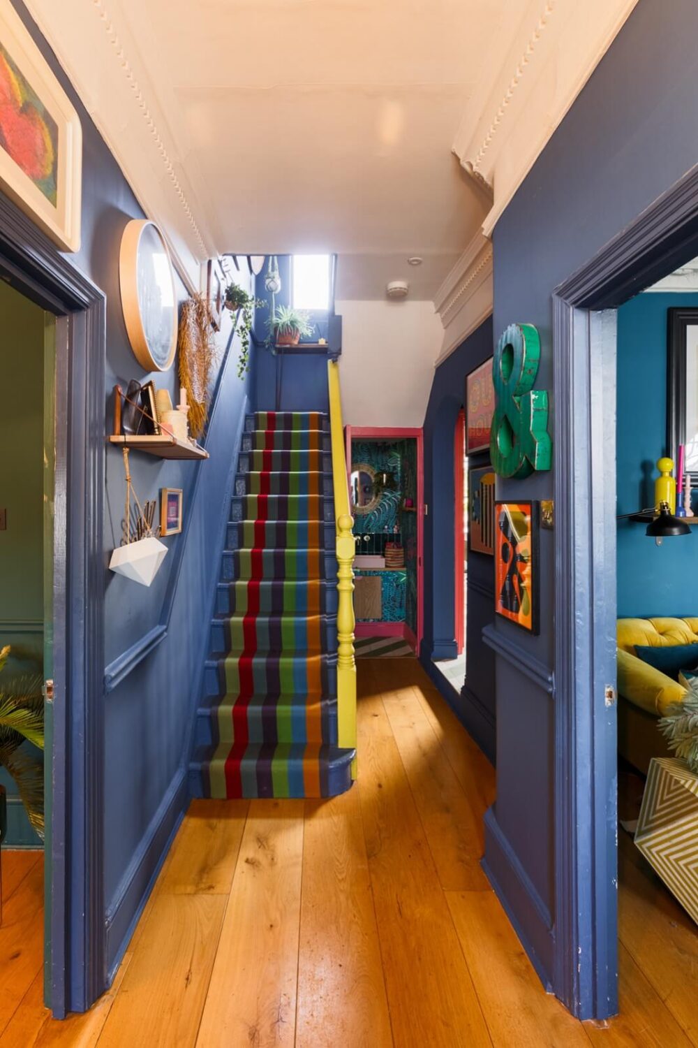 A Colorful Maximalist Home in London 27 blue-hallway-colorful-stair-runner-wooden-floor-nordroom
