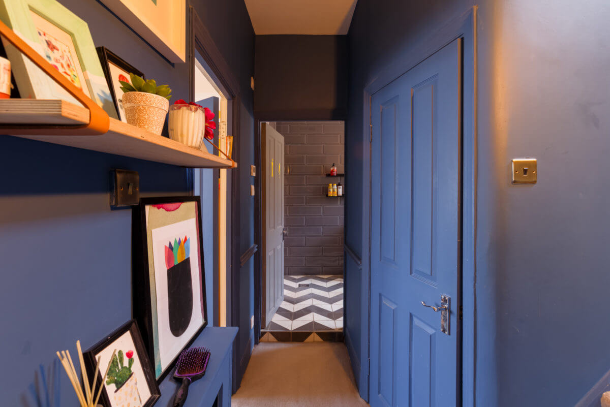 A Colorful Maximalist Home in London 32 blue-hallway-shelves-art-nordroom