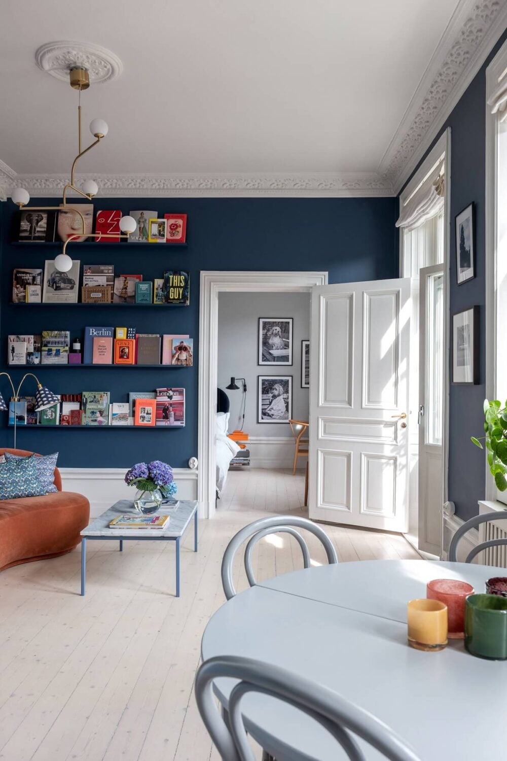 A Nordic Home with Blue Sitting Room and Kitchen 15 blue-living-room-bookshelves-colorful-apartment-nordroom