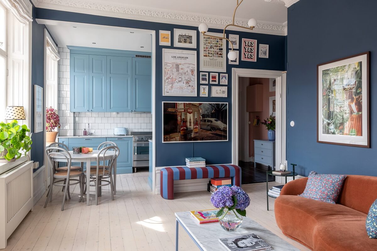 A Nordic Home with Blue Sitting Room and Kitchen 2 blue-sitting-room-gallery-wall-orange-sofa-curves-nordroom