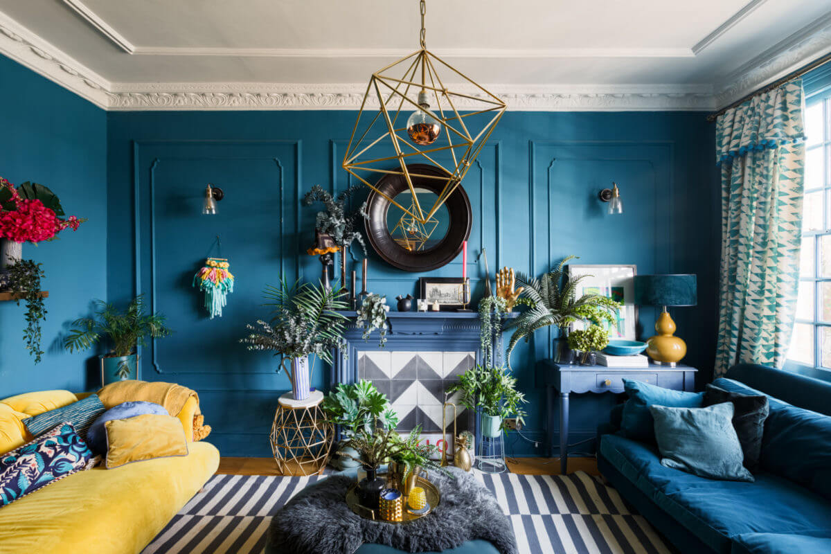 A Colorful Maximalist Home in London 23 blue-sitting-room-striped-ikea-rug-fireplace-maximalist-home-london-nordroom