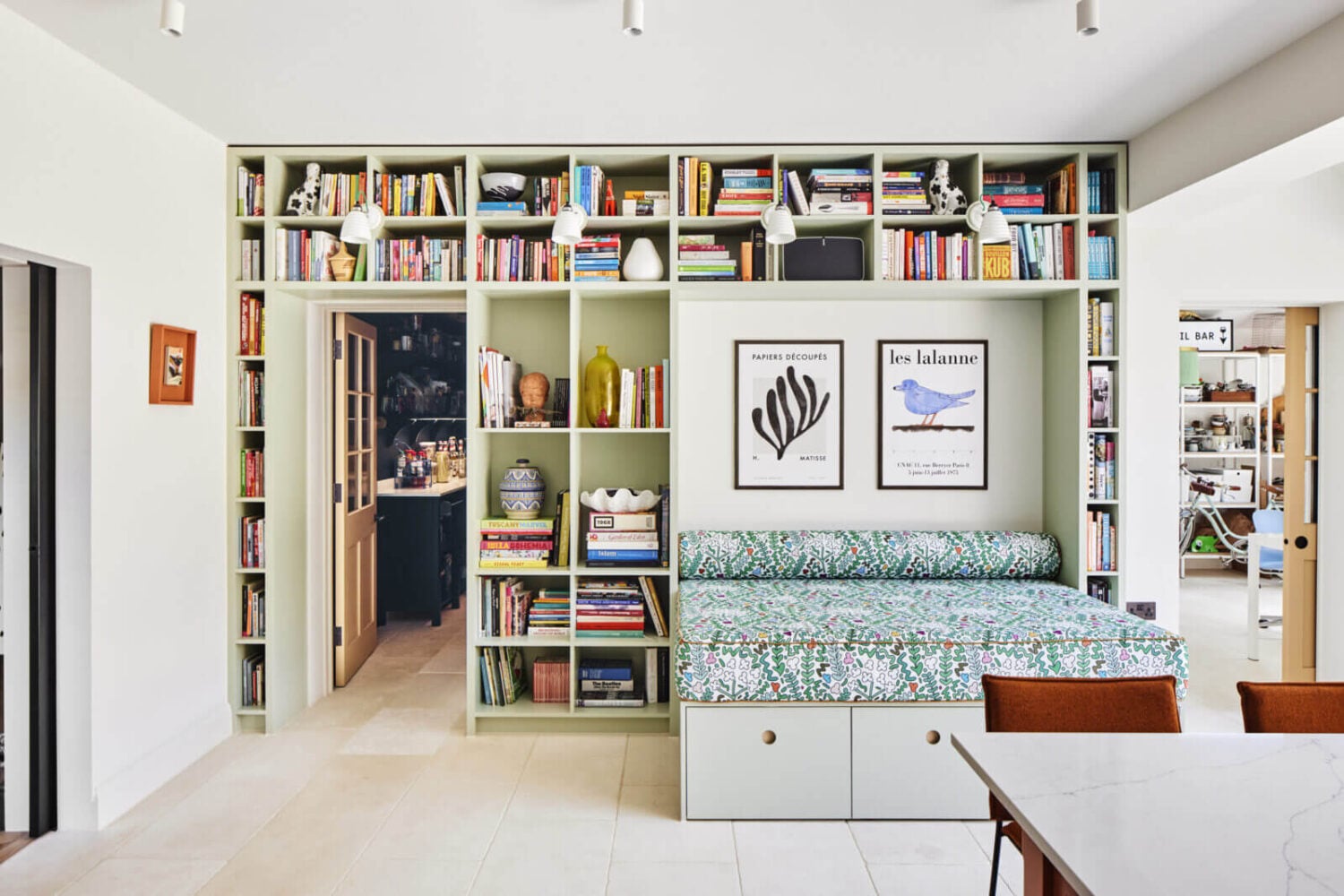 An Arts and Crafts House with Colorful Rooms 11 built-in-bench-bookshelves-green-kitchen-nordroom