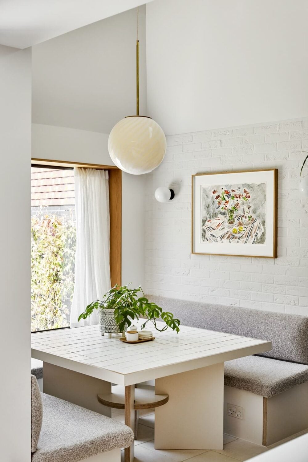 An Arts and Crafts House with Colorful Rooms 6 built-in-breakfast-nook-light-gray-kitchen-nordroom