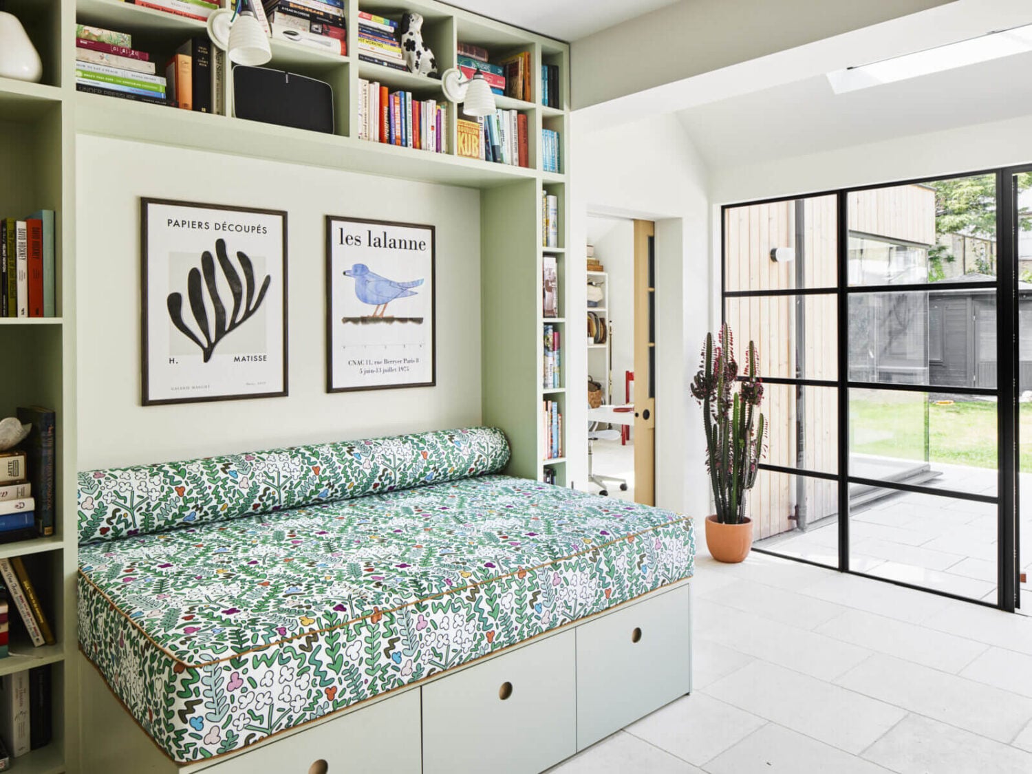 An Arts and Crafts House with Colorful Rooms 10 built-in-reading-nook-storage-bench-bookcase-nordroom