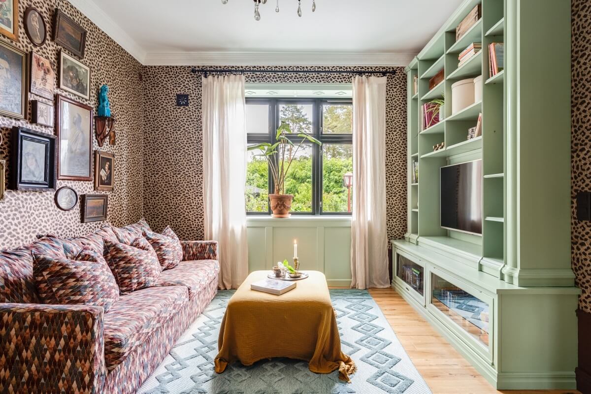 colorful-eclectic-living-room-mint-green-tv-cabinet-panter-wallpaper-gallery-wall-nordroom