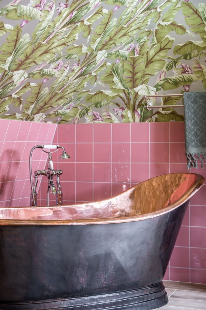 A Colorful Family Home in a Former School Building 33 copper-freestanding-bath-pink-tiles-leaf-wallpaper-nordroom