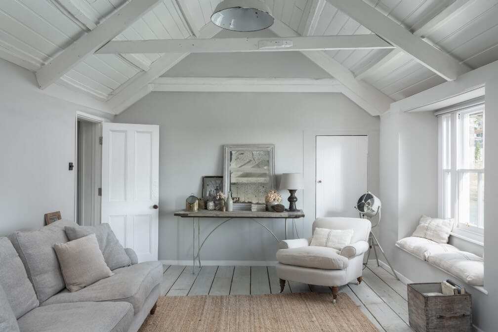 A Beautiful Seaside Cottage in Cornwall 3 cottage-sitting-room-slanted-ceiling-exposed-beams-nordroom