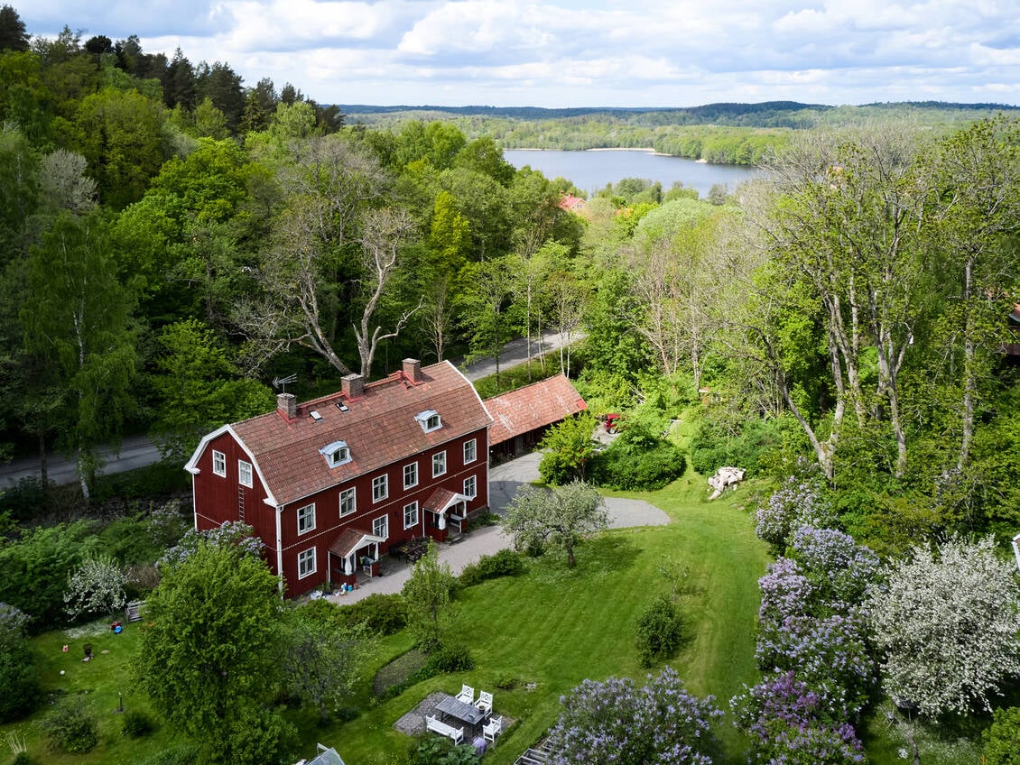 A Warm Countryside Family Home in Sweden 34 exterior red wooden house sweden garden nordroom A Warm Countryside Family Home in Sweden