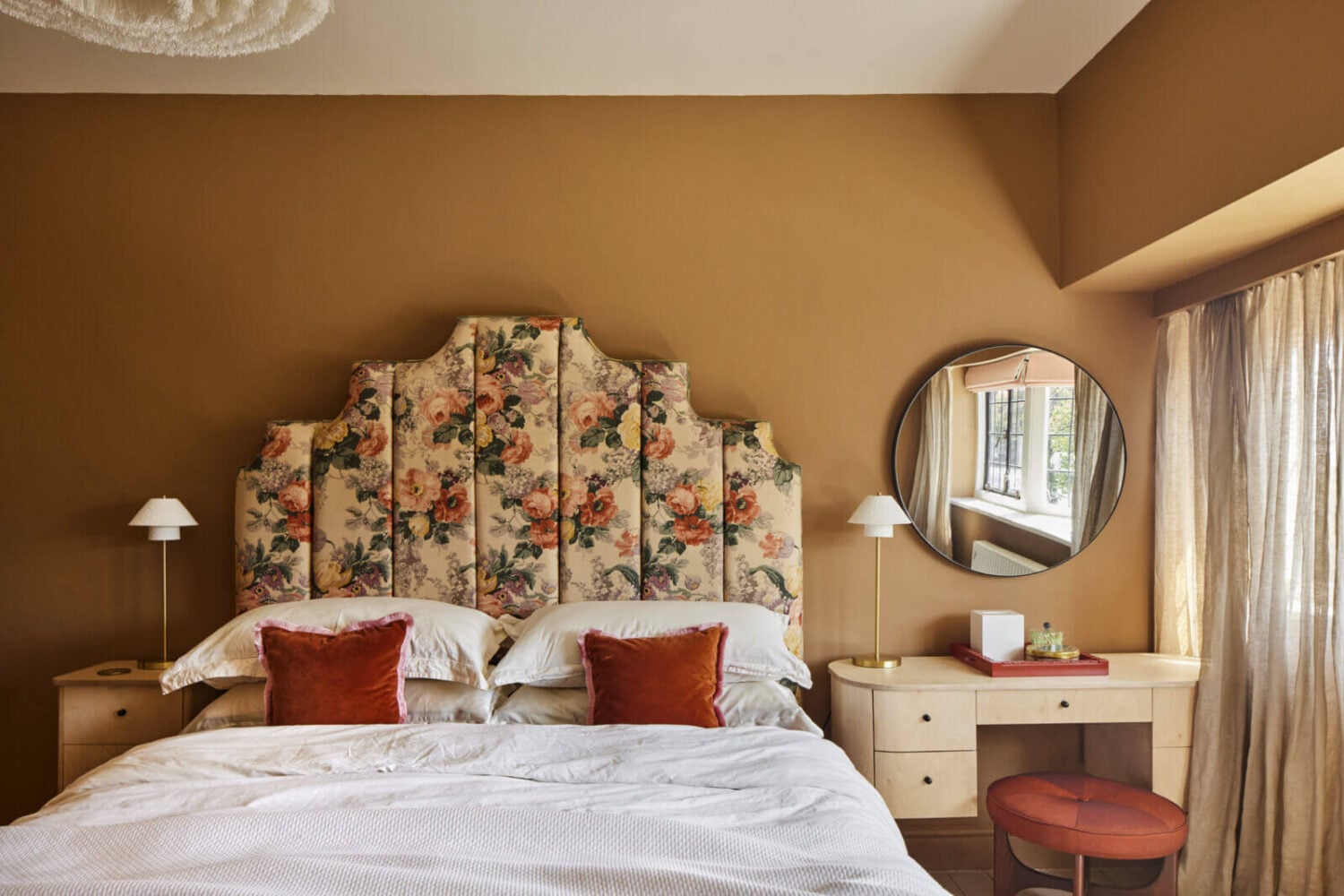 An Arts and Crafts House with Colorful Rooms 19 floral-headboard-vanity-desk-round-mirror-bedroom-warm-wall-colors-nordroom