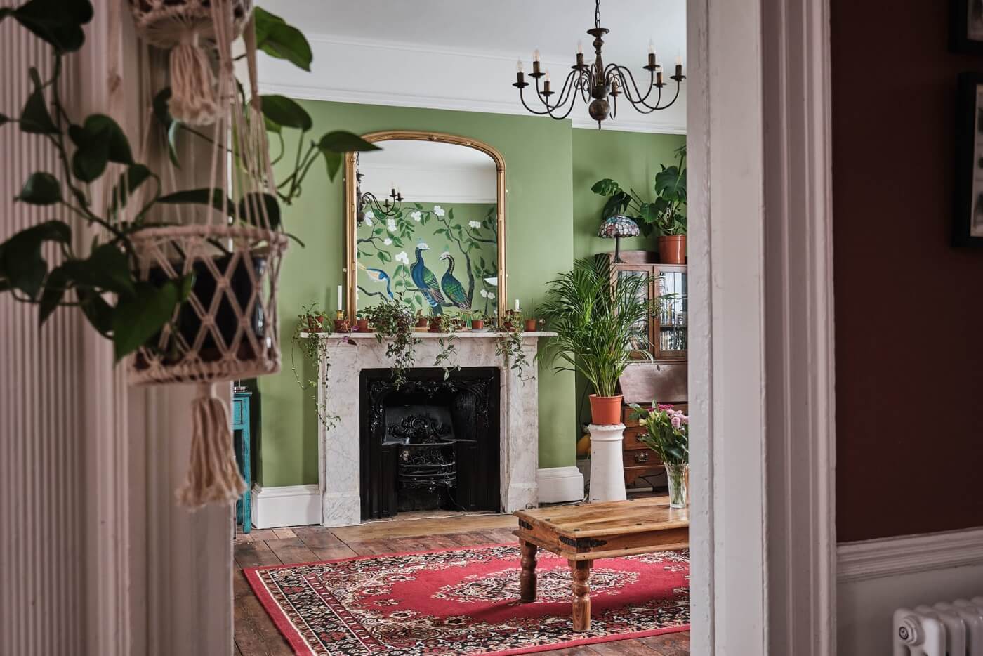 A Colorful Eclectic Home in England 9 green-eclectic-sitting-room-fireplace-nordroom