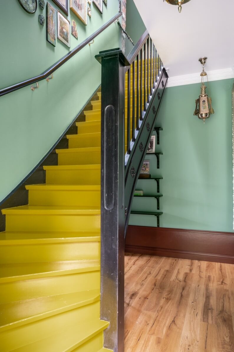 A Colorful Family Home in a Former School Building 20 green-hallway-yellow-stairs-nordroom