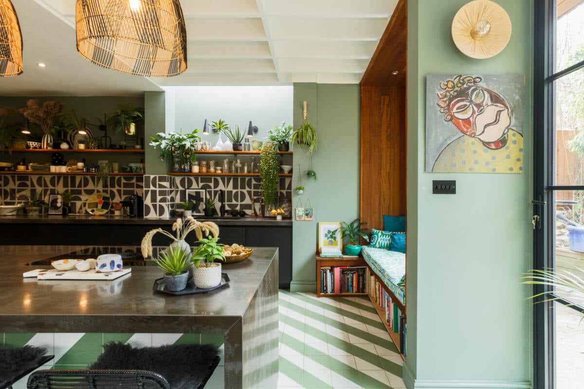 A Colorful Maximalist Home in London 2 green-kitchen-window-seat-reading-nook-black-kitchen-cabinets-island-nordroom