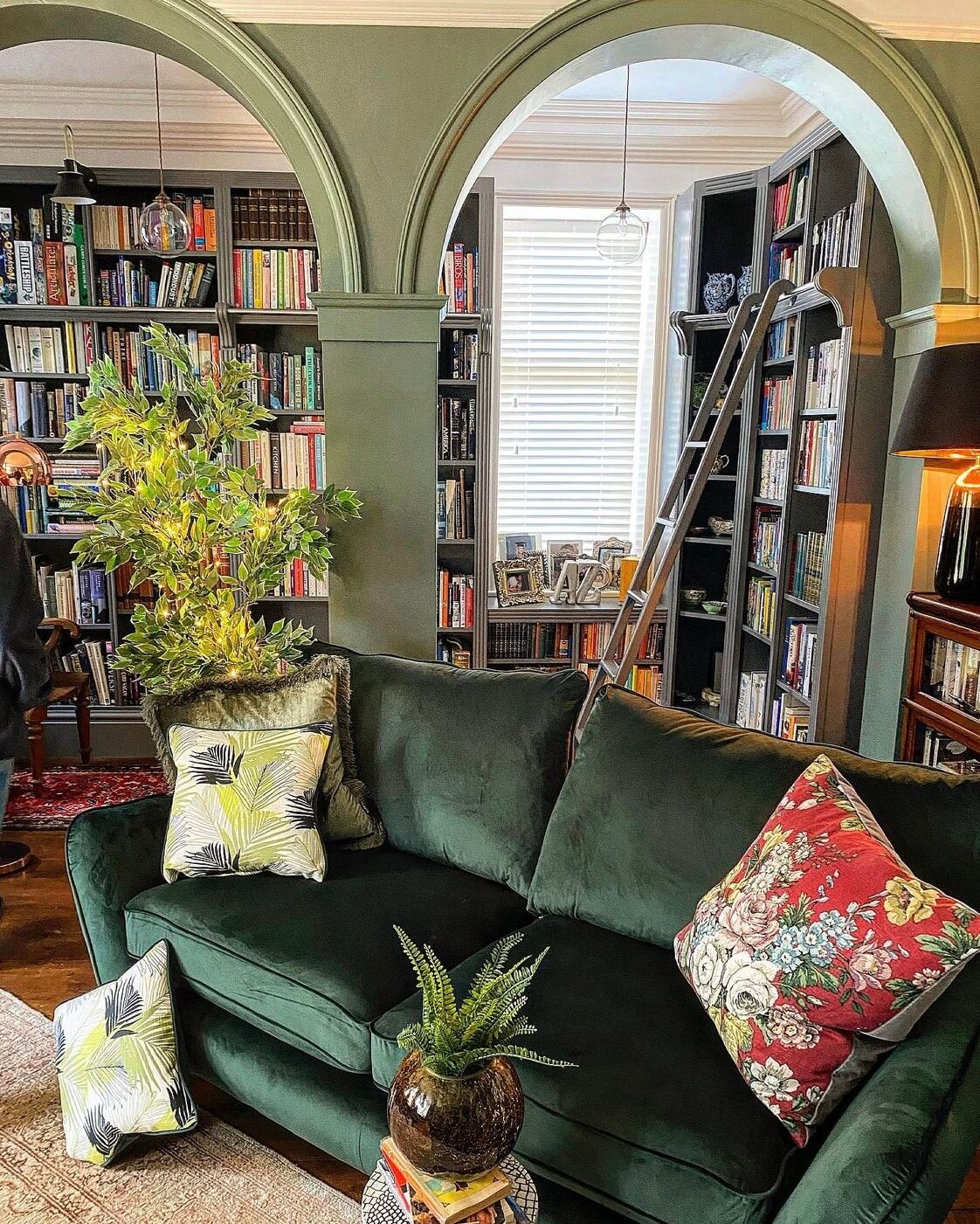 A Wonderful Eclectic Maximalist Home in England 1 green-sitting-room-arches-library-room-nordroom
