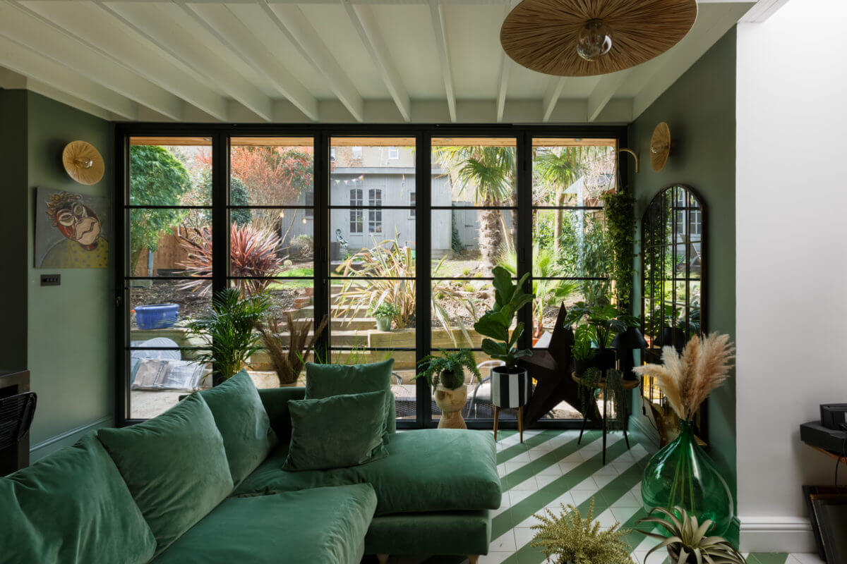 A Colorful Maximalist Home in London 16 green-sitting-room-terrace-doors-modern-extension-edwardian-home-london-nordroom