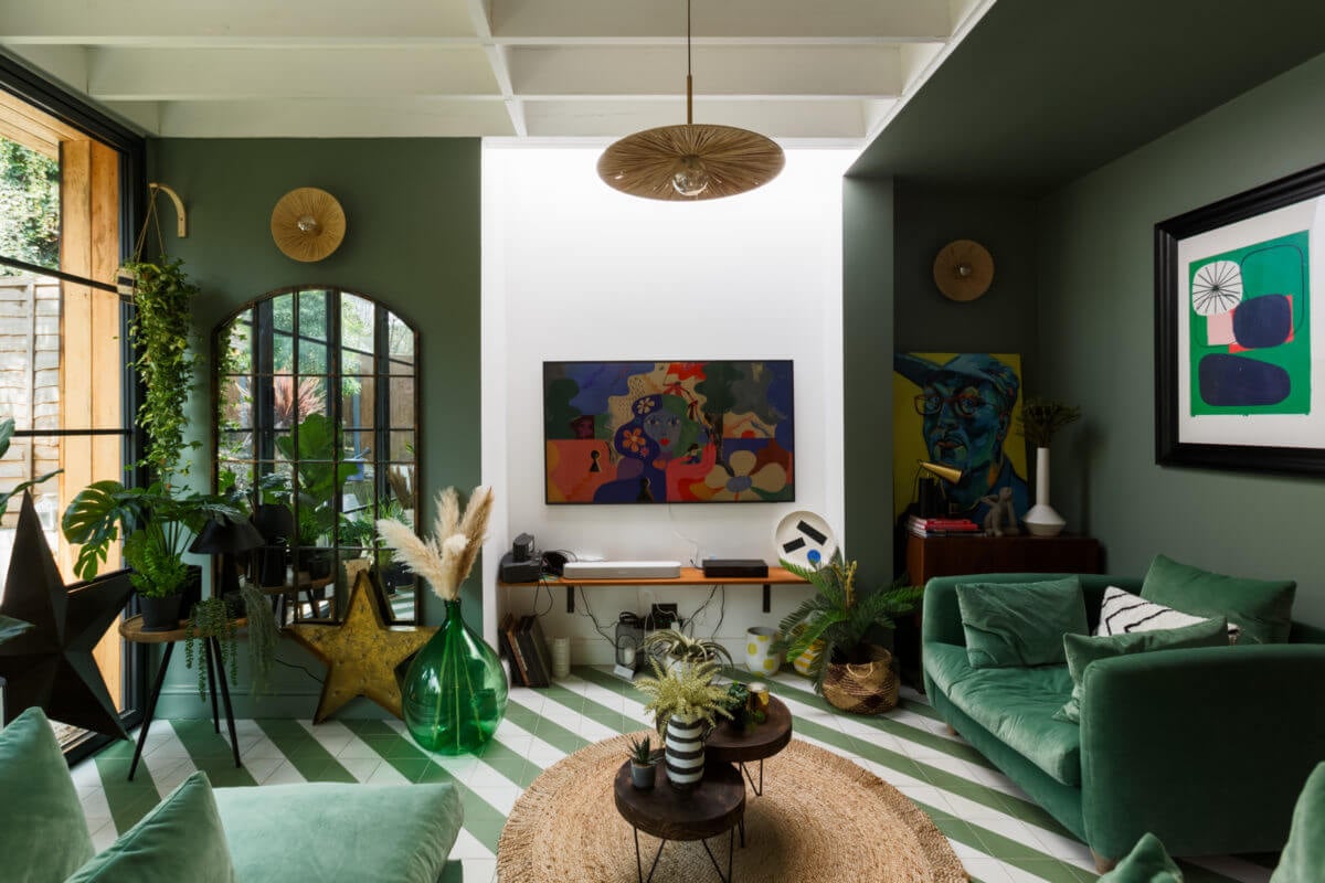 A Colorful Maximalist Home in London 18 green-sitting-room-velvet-armchair-green-white-floor-nordroom