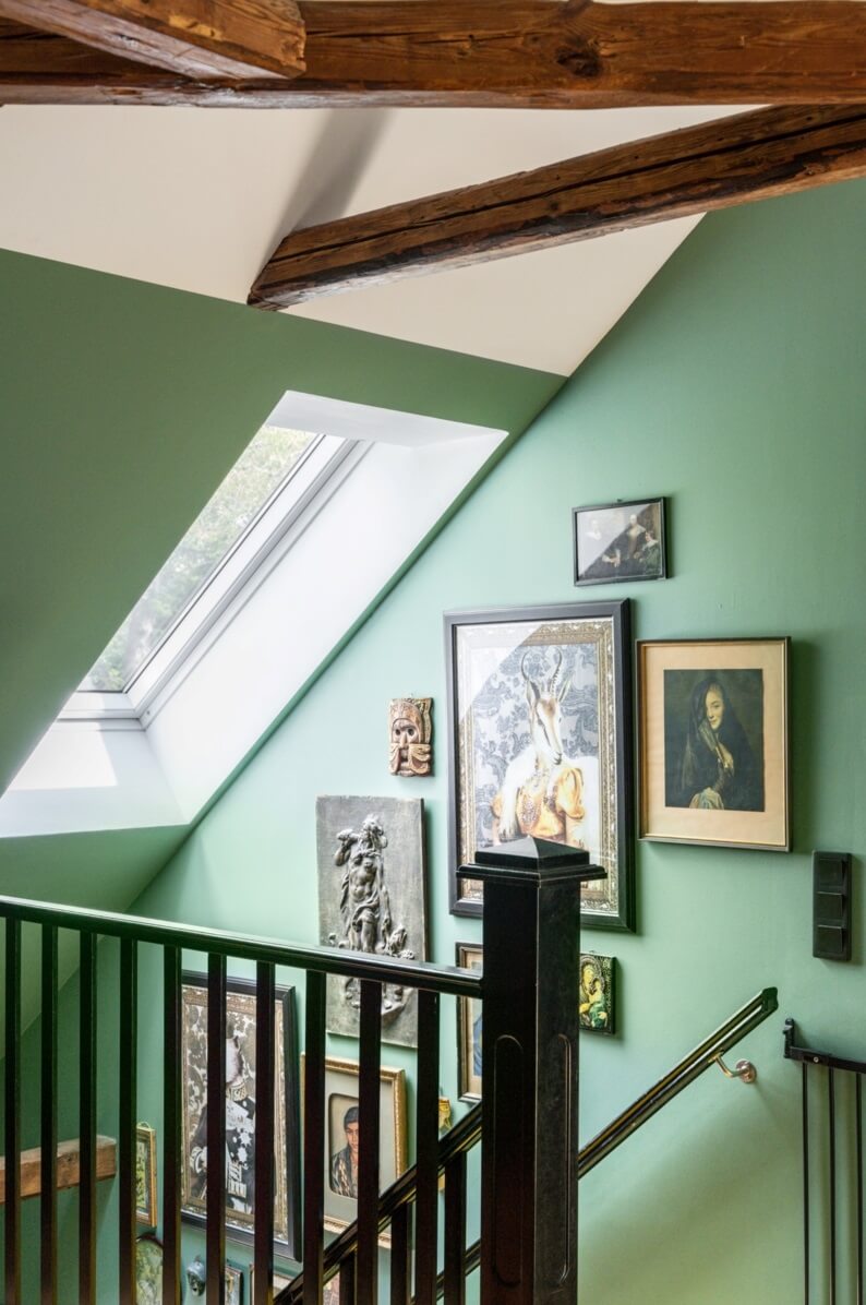 A Colorful Family Home in a Former School Building 37 green-staircase-exposed-beams-gallery-wall-nordroom
