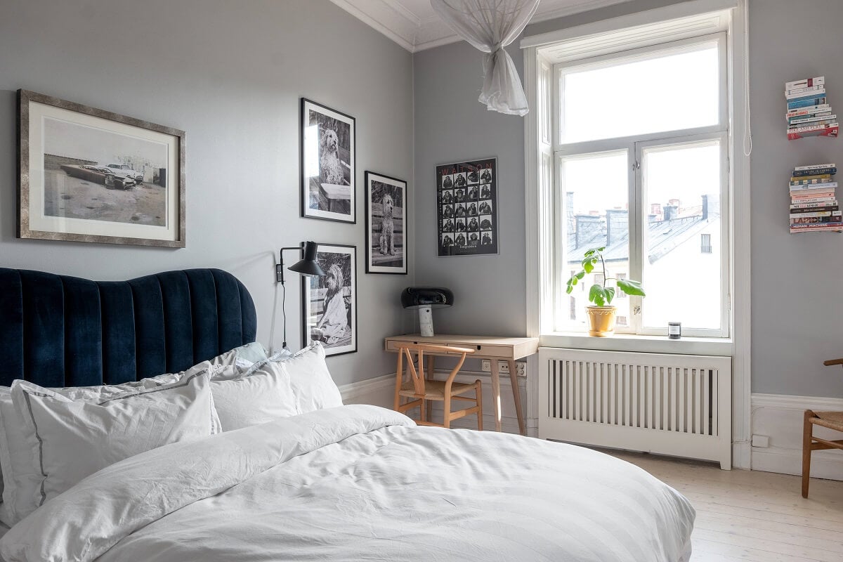 A Nordic Home with Blue Sitting Room and Kitchen 22 green-velvet-headboard-light-gray-bedroom-nordroom