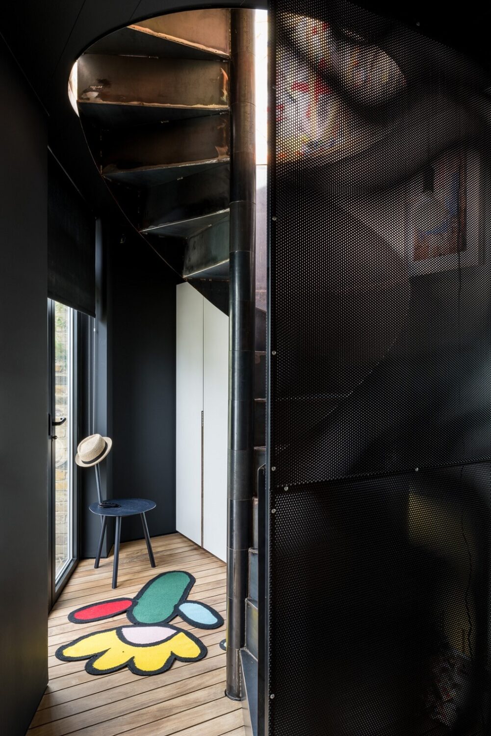 A Spectacular Modern Black Loft in London 15 hallway-painted-wooden-floorboards-spiral-staircase-nordroom