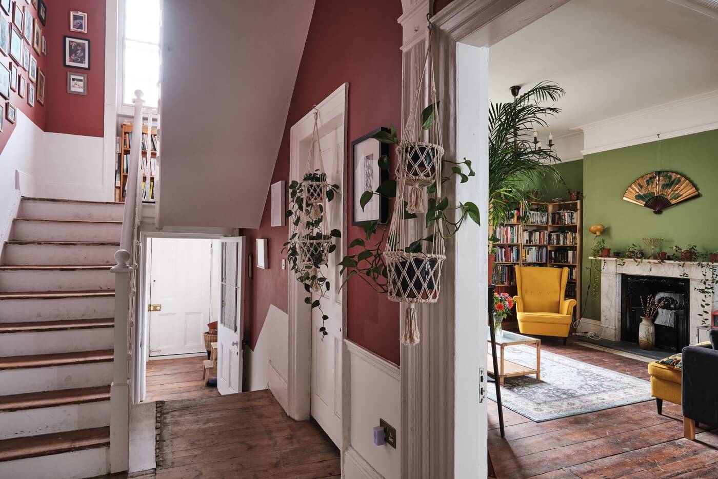 A Colorful Eclectic Home in England 10 hallway-wooden-floor-red-walls-green-living-room-nordroom