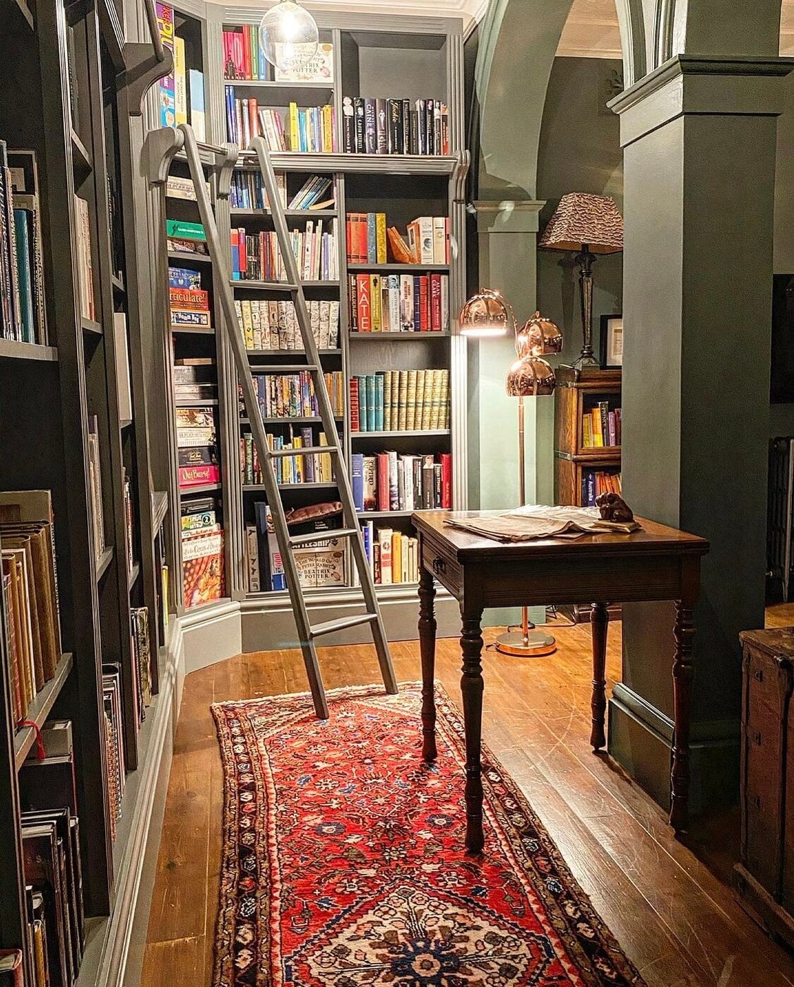 A Wonderful Eclectic Maximalist Home in England 8 home-library-vintage-rug-bookshelves-living-room-nordroom