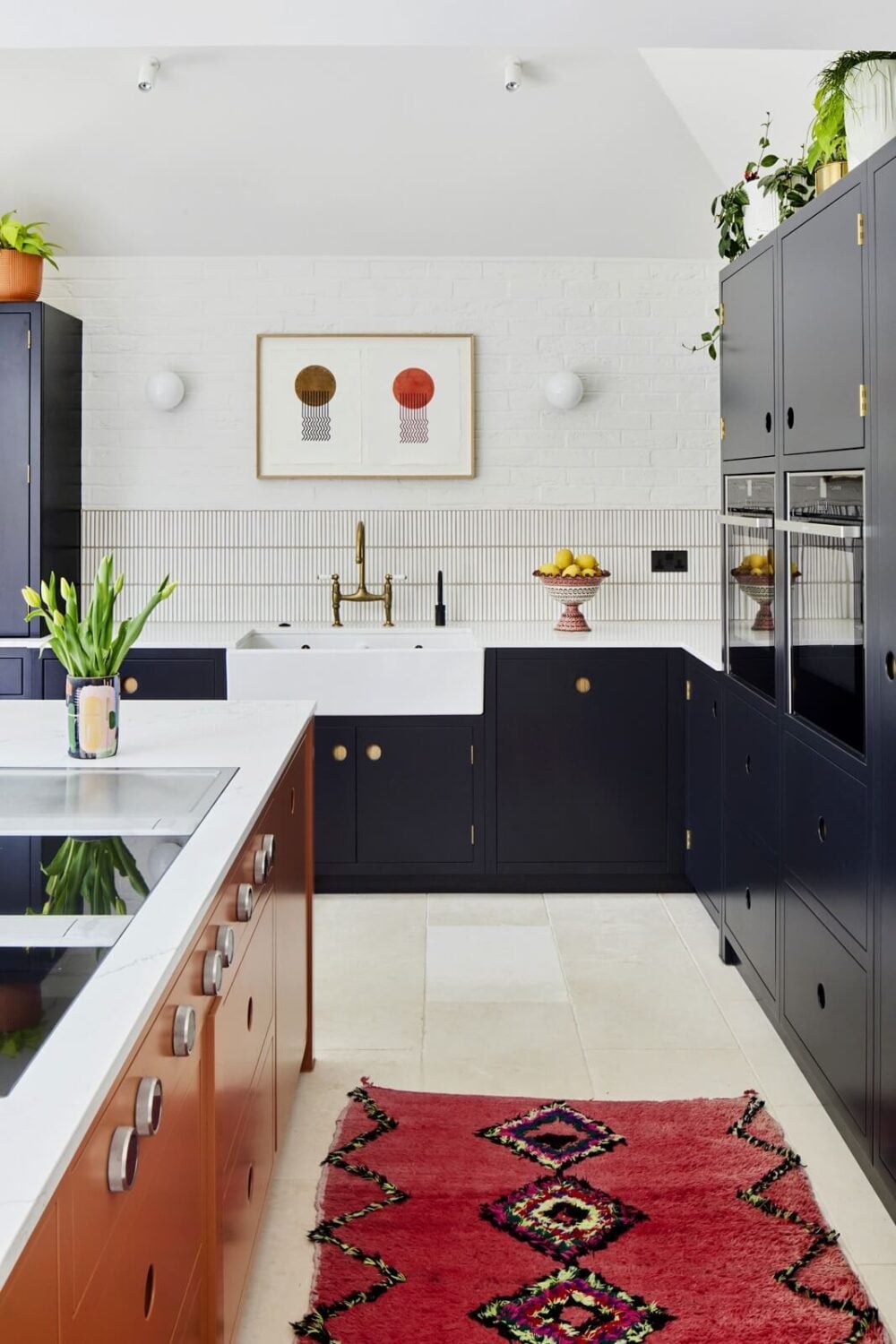 An Arts and Crafts House with Colorful Rooms 4 kitchen-blue-cabinets-pink-rug-nordroom
