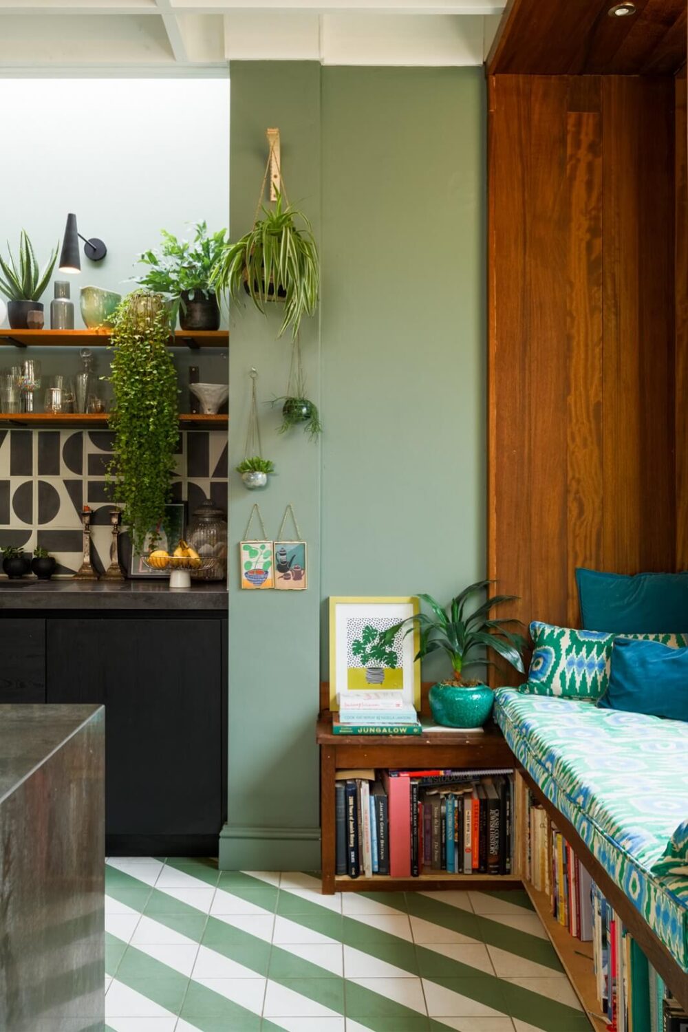 A Colorful Maximalist Home in London 12 kitchen-green-walls-window-seat-book-storage-reading-nook-nordroom