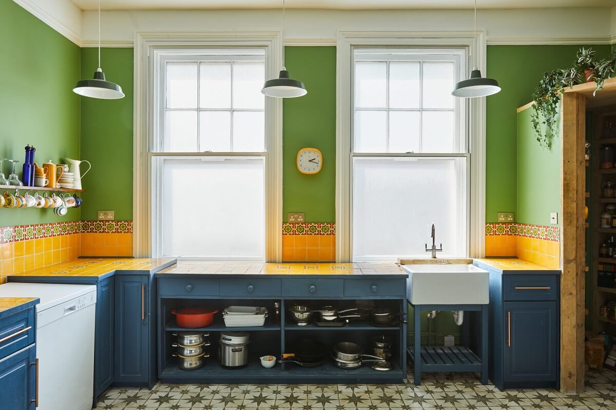 A Colorful Eclectic Home in England 20 kitchen-green-walls-yellow-tiles-blue-cabinets-nordroom
