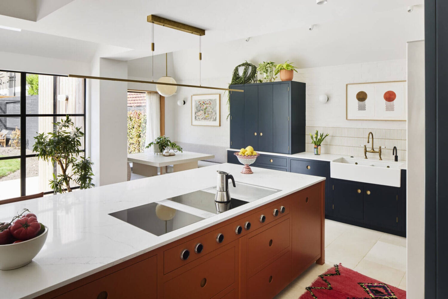 An Arts and Crafts House with Colorful Rooms 5 kitchen-island-brown-cabinets-blue-cabinets-nordroom