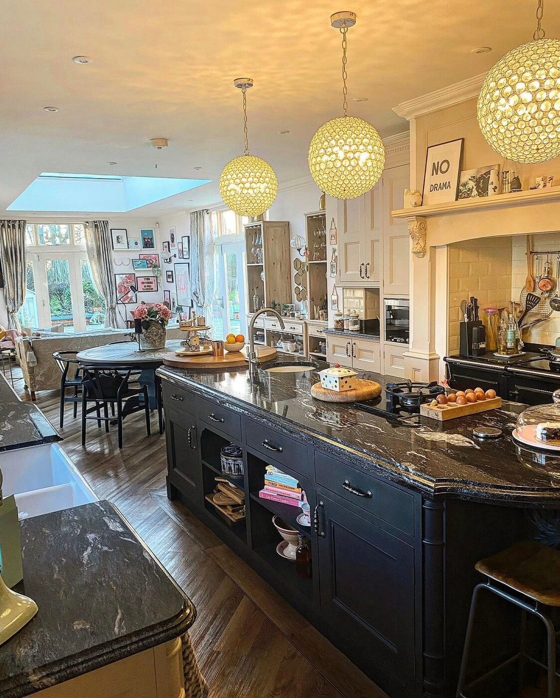A Wonderful Eclectic Maximalist Home in England 9 kitchen-rounded-kitchen-island-sitting-area-nordroom