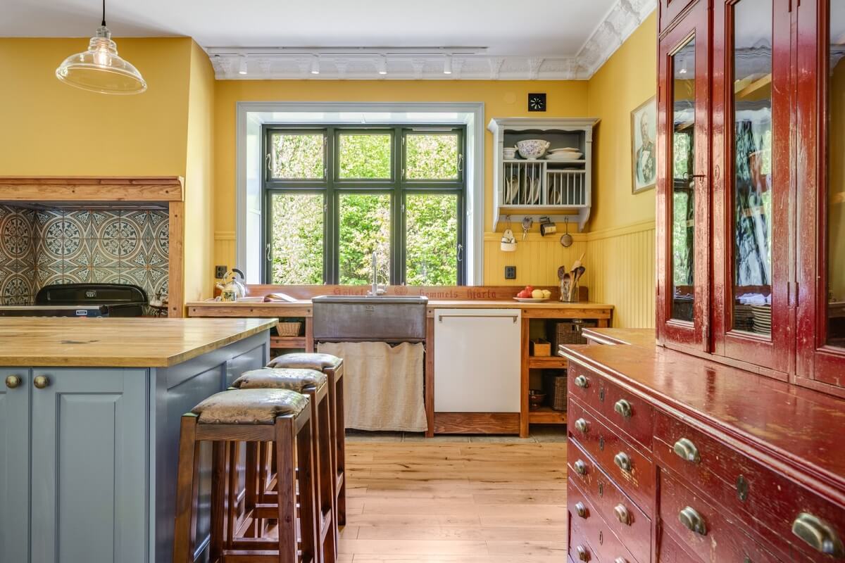 A Colorful Family Home in a Former School Building 10 kitchen-yellow-walls-red-vintage-cabinet-nordroom