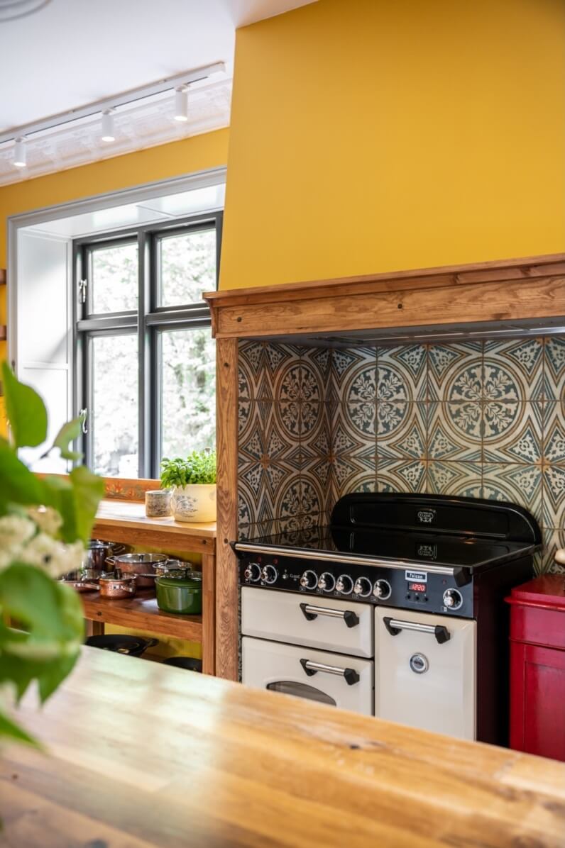 A Colorful Family Home in a Former School Building 11 kitchen-yellow-walls-tiles-nordroom